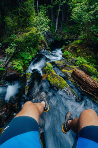 Boots Dangling Over A Stream Below Praděd