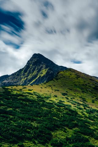 Clouds Streaming Over a Ridge
