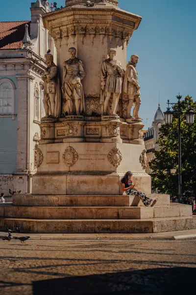 Resting at the Foot of the Monument in Praça de Luís de Camões
