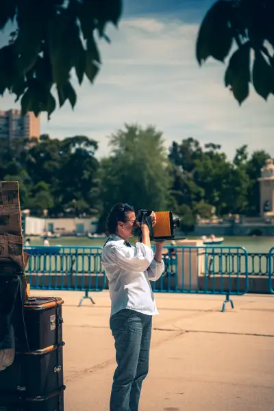 Lady taking picture with old camera
