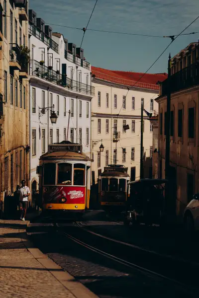 Tram 28s Meeting in the Shadow of Lisbon's Streets