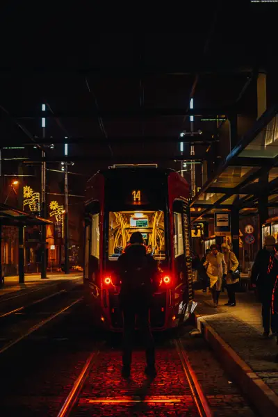 Person in front of tram