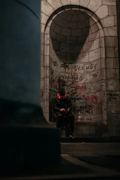 Person sitting in outside of the Palace of Culture and Science