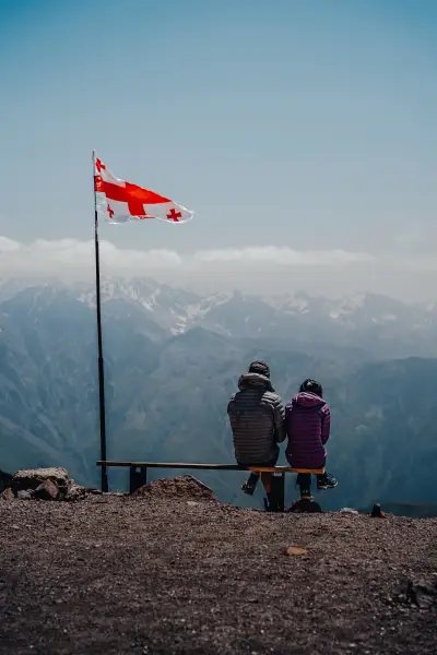Georgian Flag Over a Grand Mountain Vista
