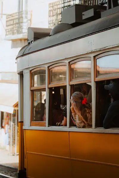 A Pensive Passenger in the Tram Window