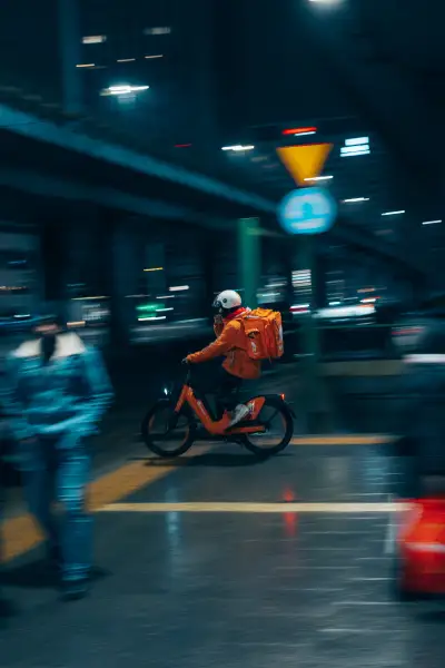 Panning shot of a food delivery guy