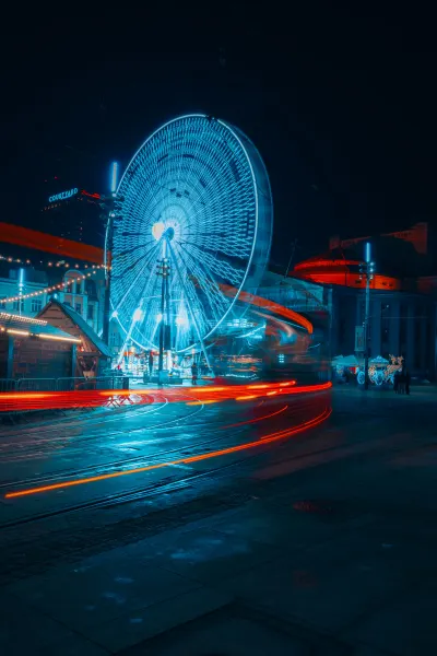 Tram long exposure with Ferris wheel in the background