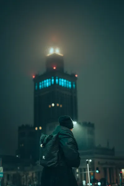 Woman with Palace of Culture and Science in the background