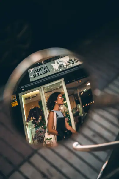Woman reflection in scooter mirror