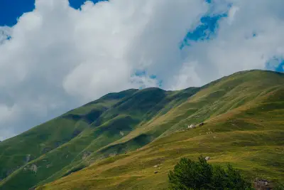 Velvet Green Slopes and Dramatic Sky