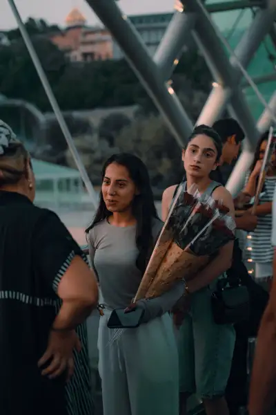 Women with Roses on the Bridge of Peace