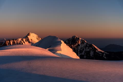 Golden Alpenglow on the Snowy Ridge