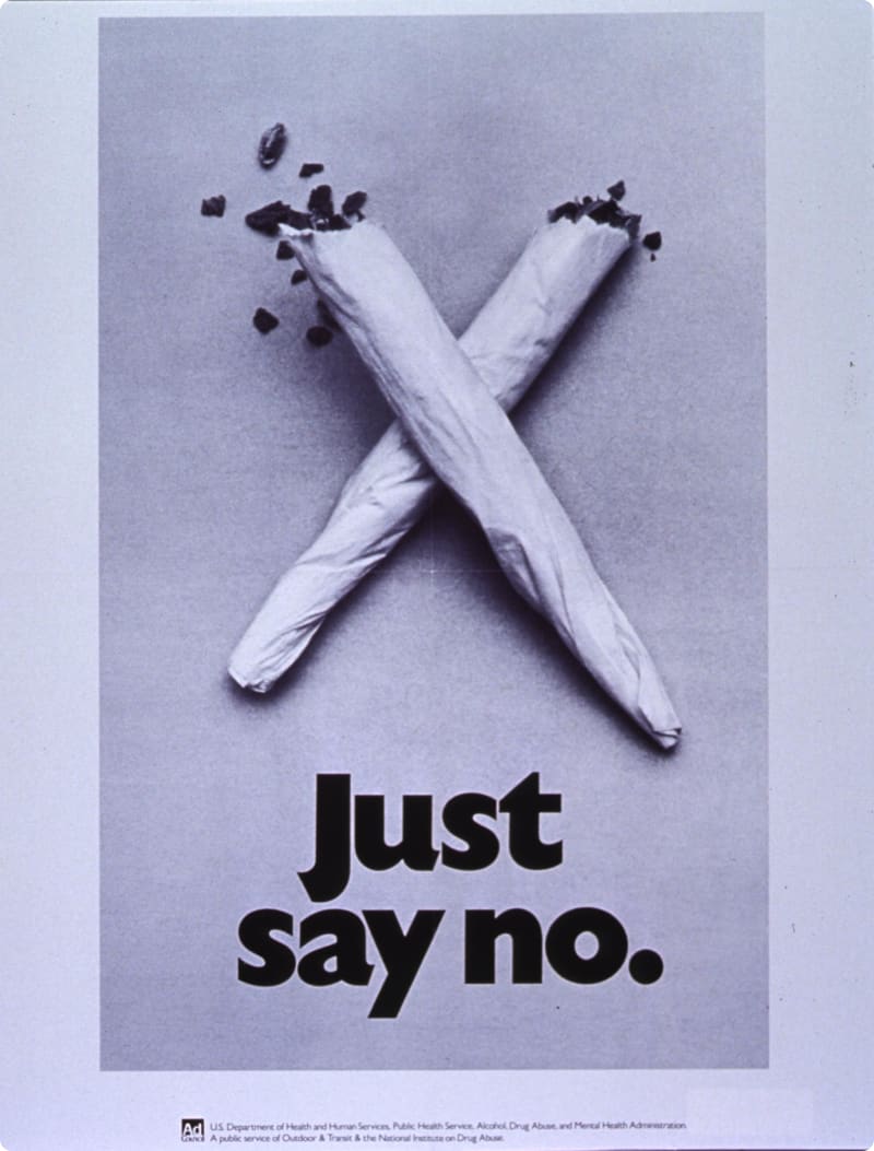 Black and white anti-drug poster featuring two rolled cigarettes crossed in an "X" shape, with the text "Just say no" prominently displayed below.
