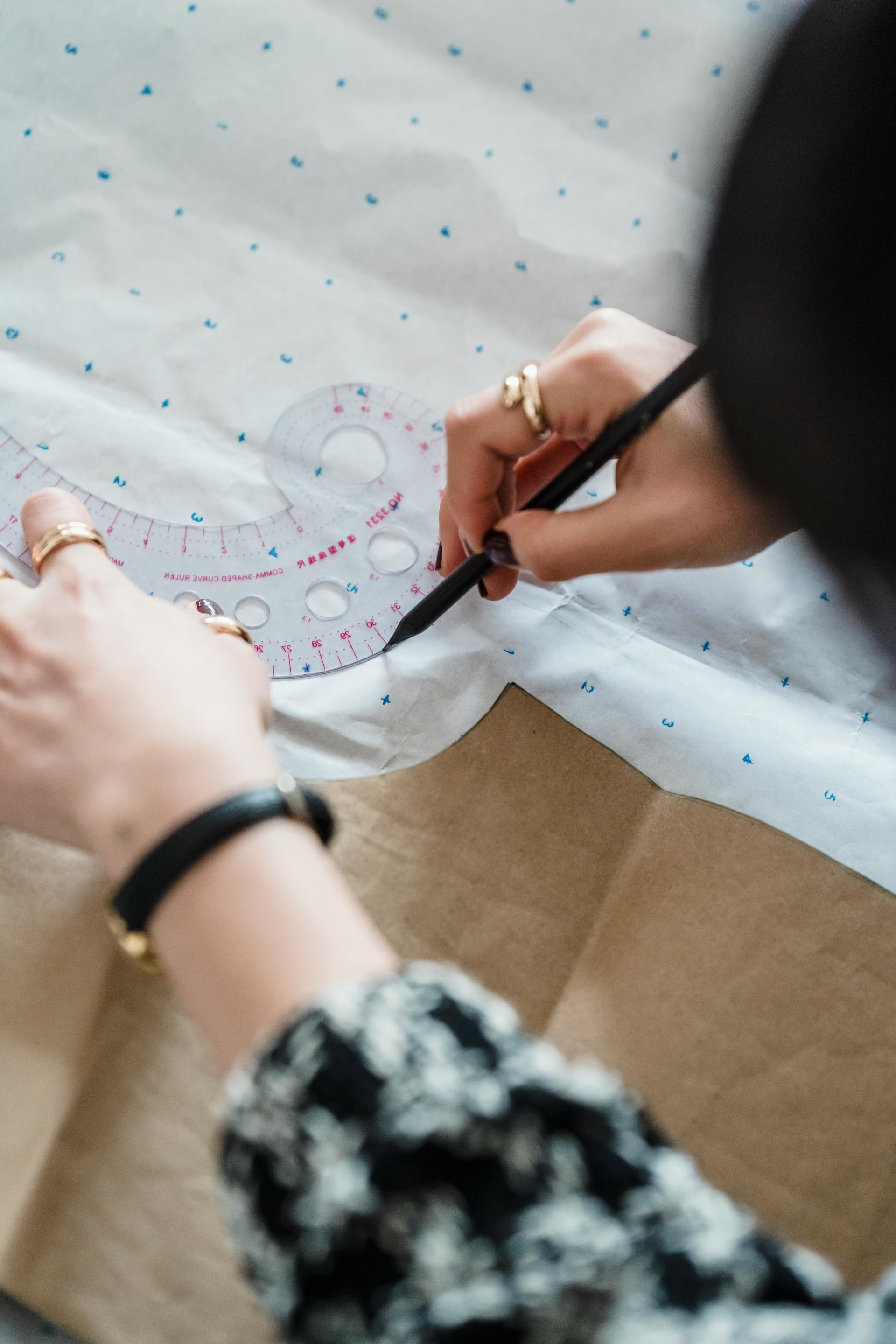 Designer working on pattern making with precision tools