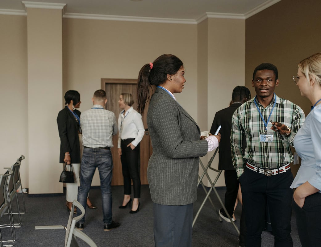 Conference room with people discussing