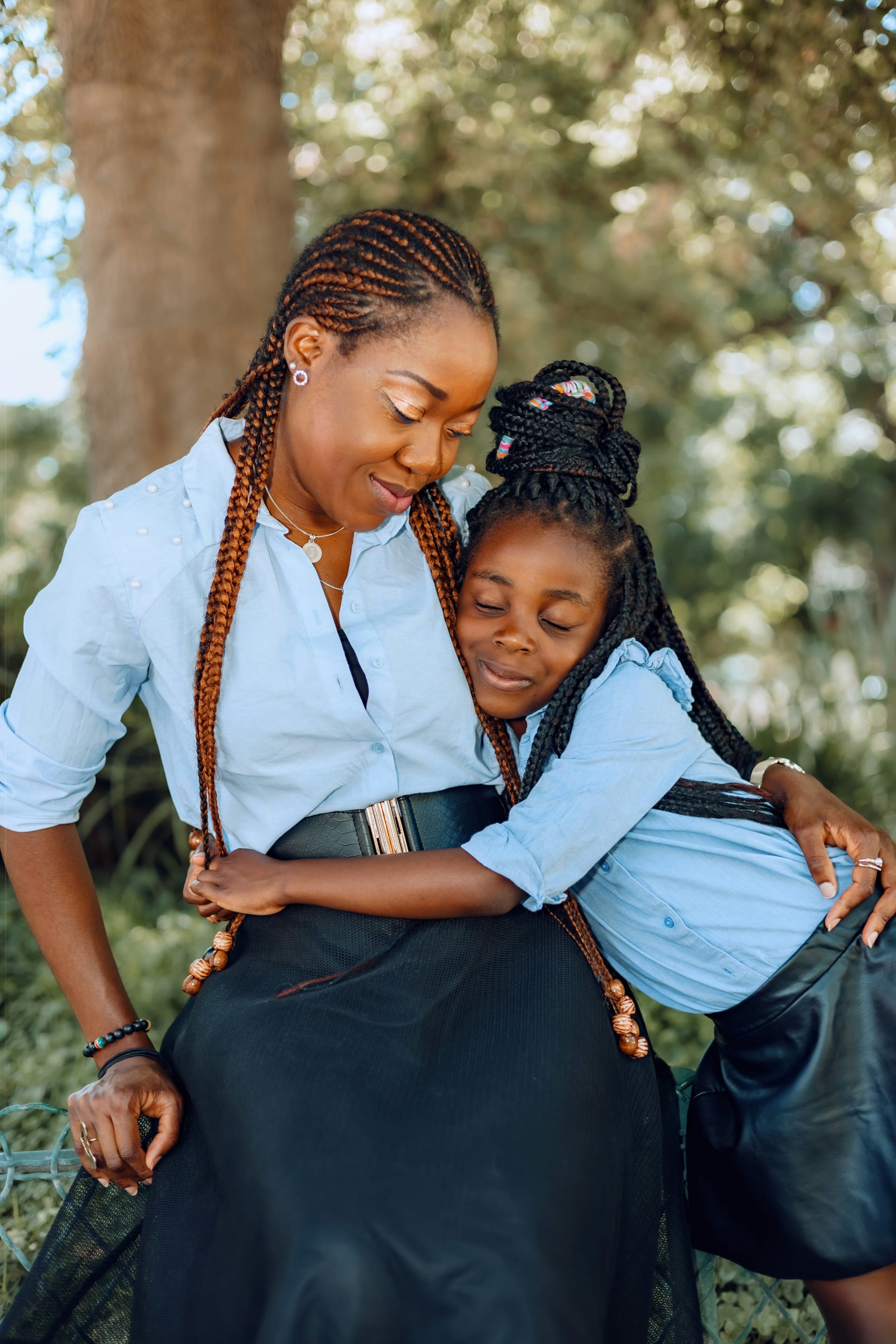 A little girl hugging her mother