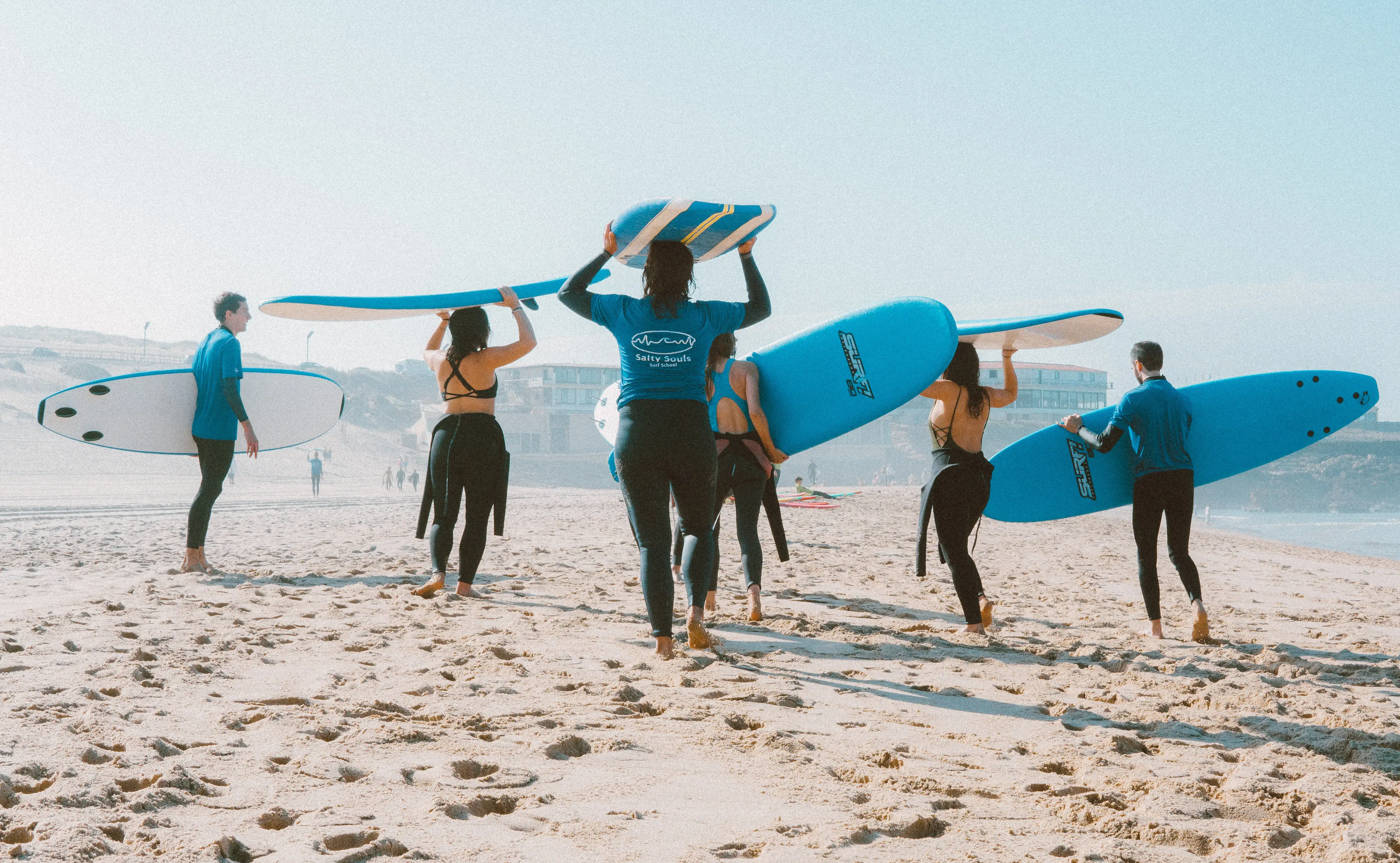people with surfboards