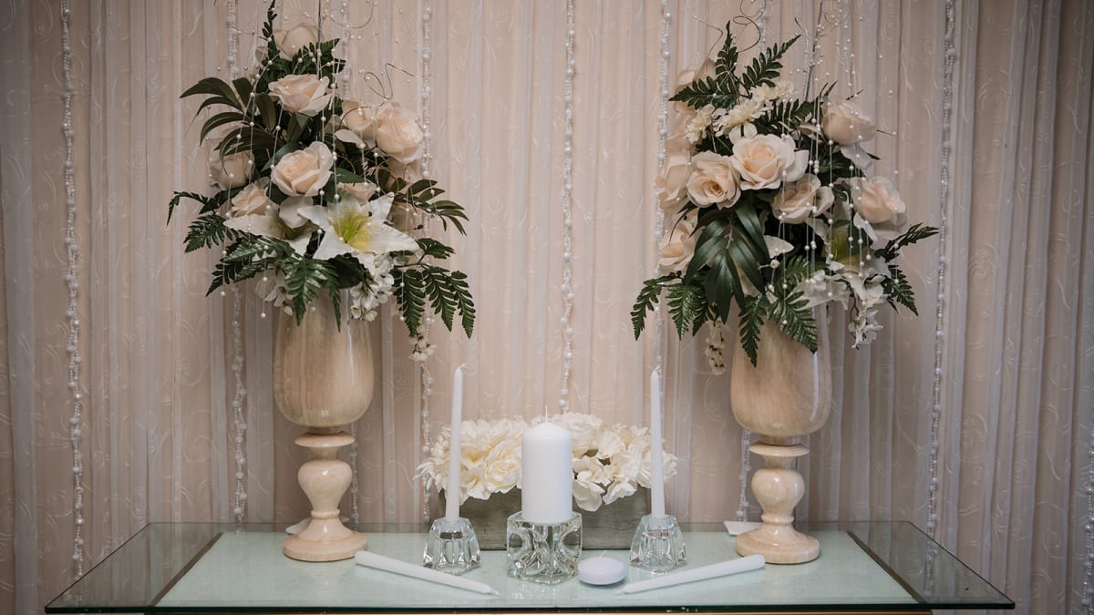 The chapel altar with white flowers and candles