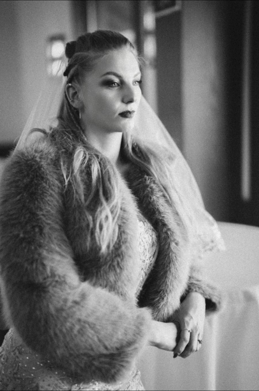 Bride in a fur coat, black and white