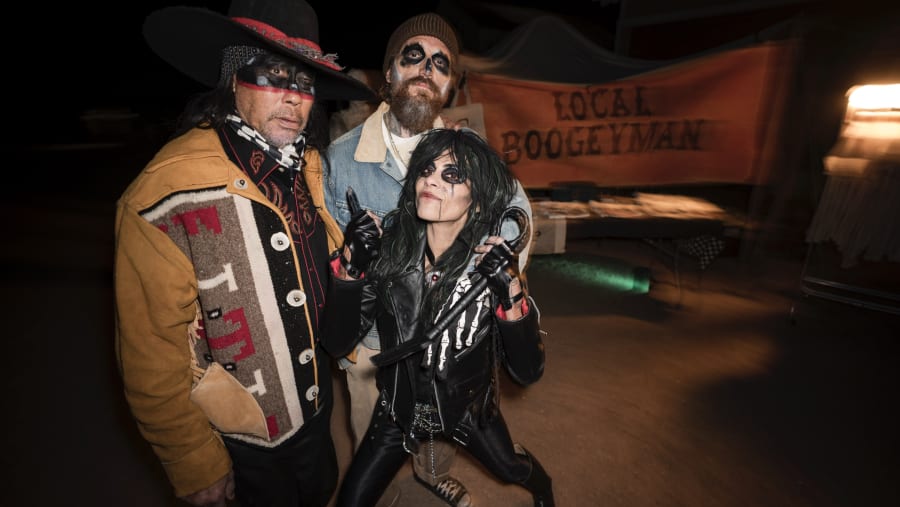 Costumed trio at a Halloween party