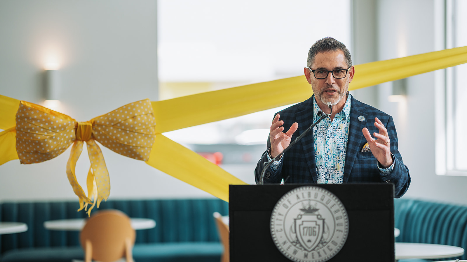 Wide view of the ceremony setup and assembled guests at the Clearinghouse ribbon cutting, Santa Fe