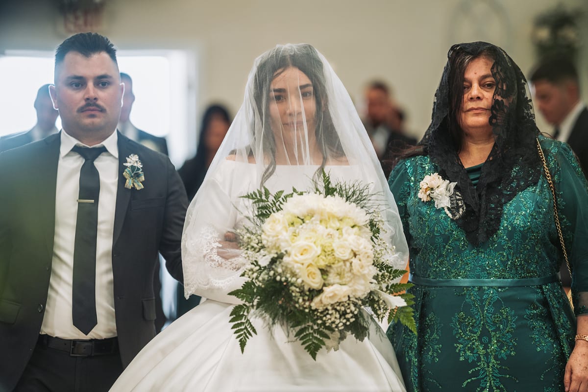 Emotional wedding moment in warm ambient light — Casey Addason Photography