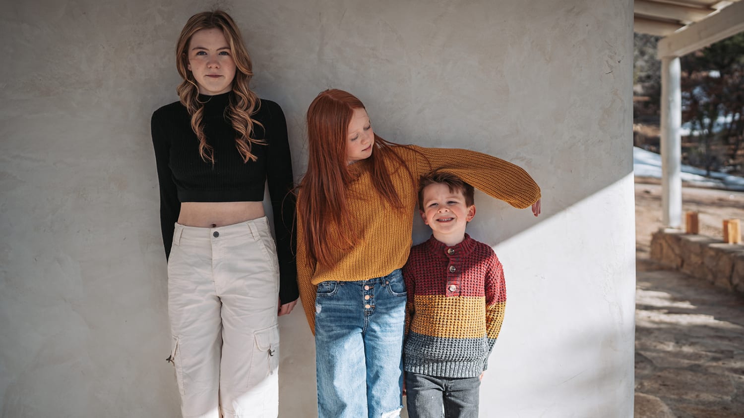 Bishops Lodge wedding photographer Santa Fe - This casual family portrait was captured outdoors against a minimalist concrete wall structure, like