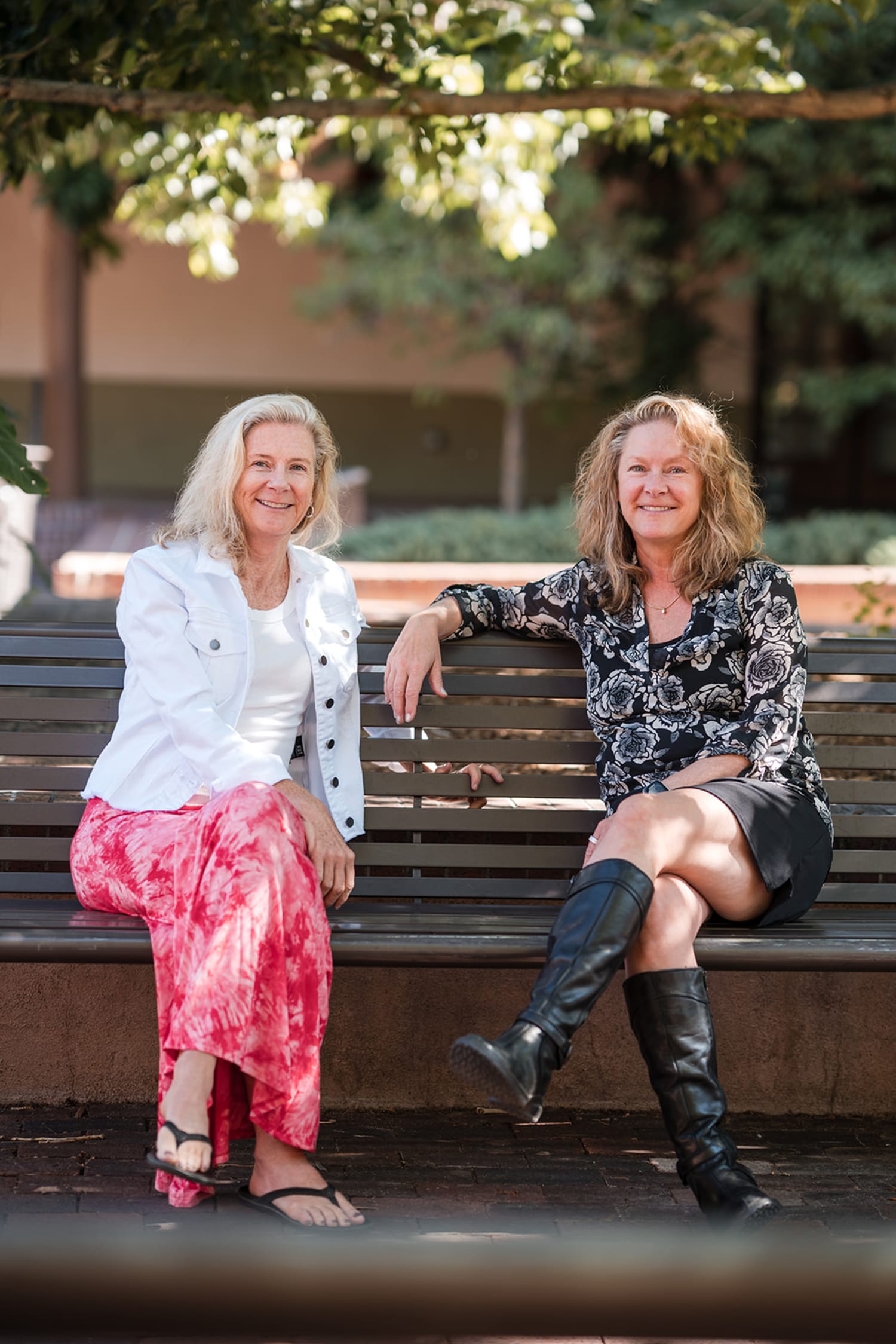 portrait session captures two women seated on a wooden bench in what appears to be a Southwestern... — Casey Addason Photography