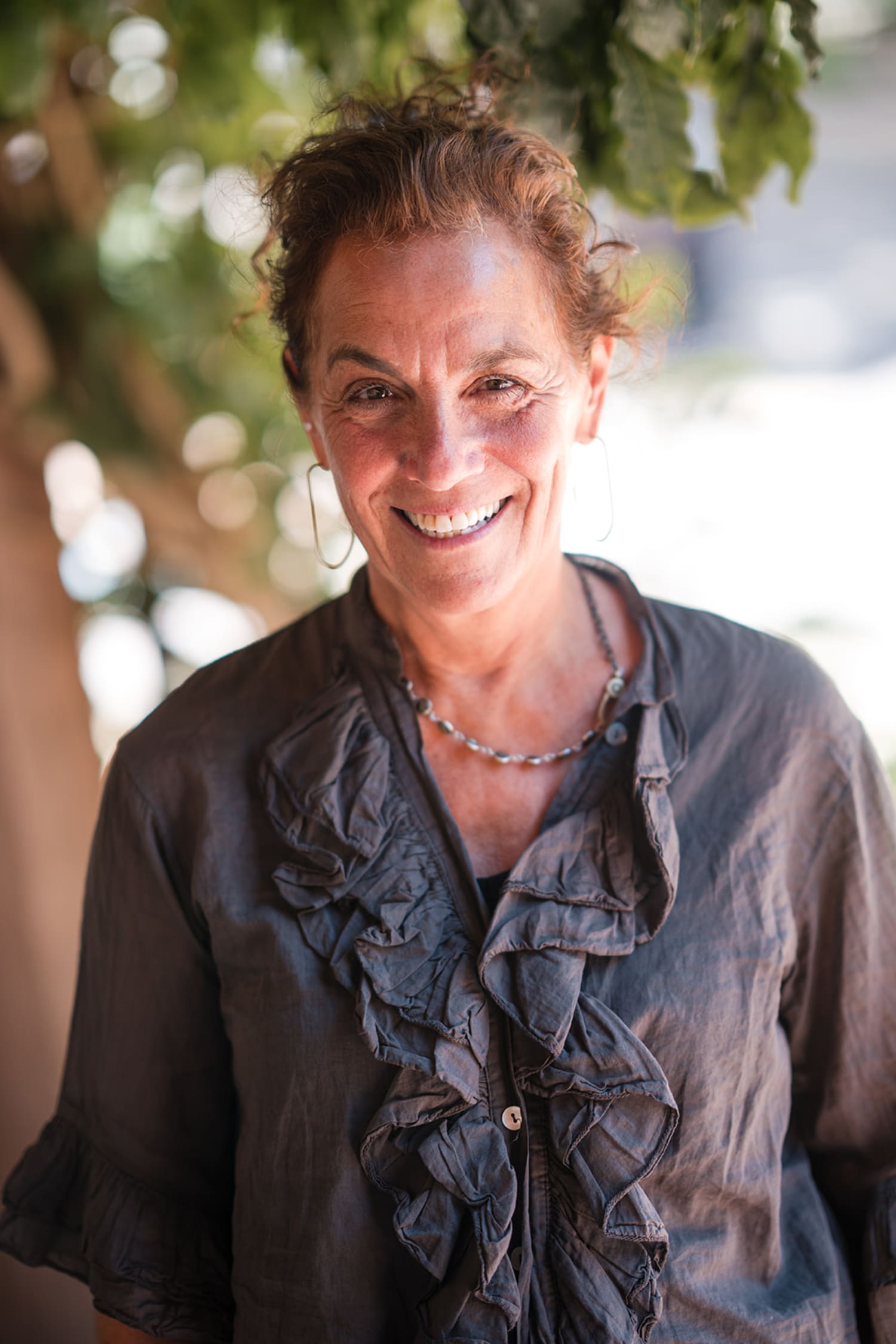 is an outdoor portrait photograph taken during golden hour, with natural sunlight creating warm t... — Casey Addason Photography