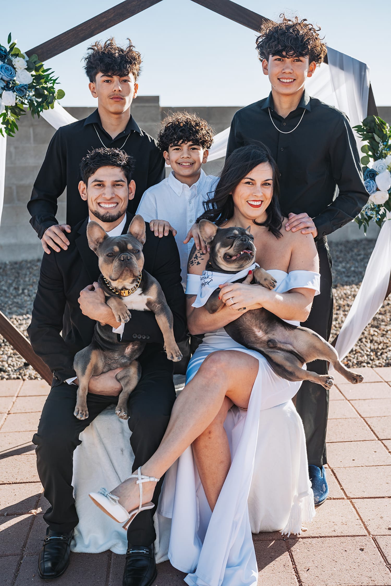 family portrait was documented on a modern rooftop or terrace venue during golden hour, with archit... — Casey Addason Photography