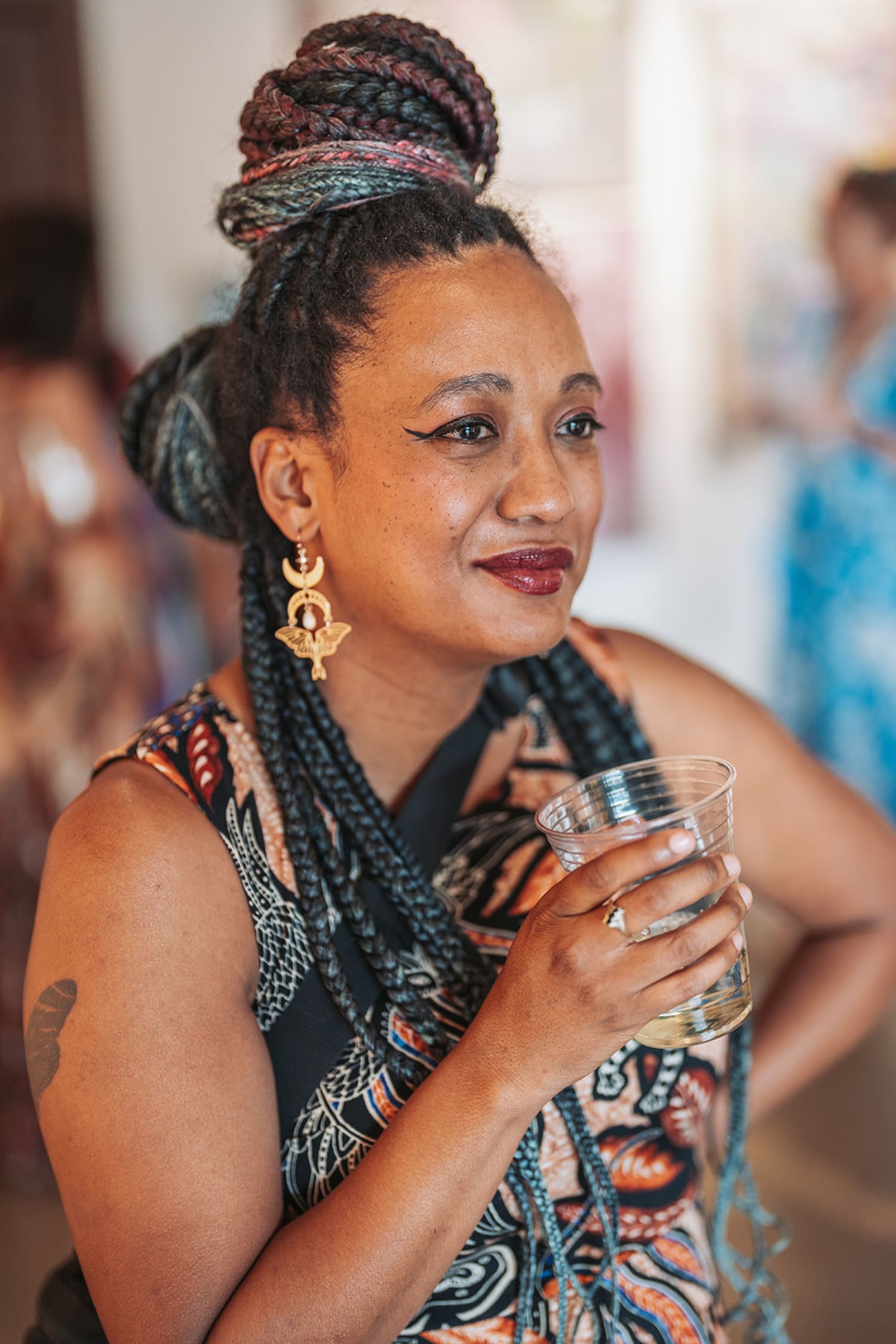 portrait captures a woman at what appears to be a social gathering or event, photographed with so... — Casey Addason Photography