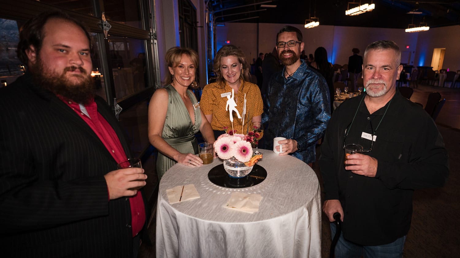 reception took place in a modern venue with floor-to-ceiling windows and contemporary architectur... — Casey Addason Photography