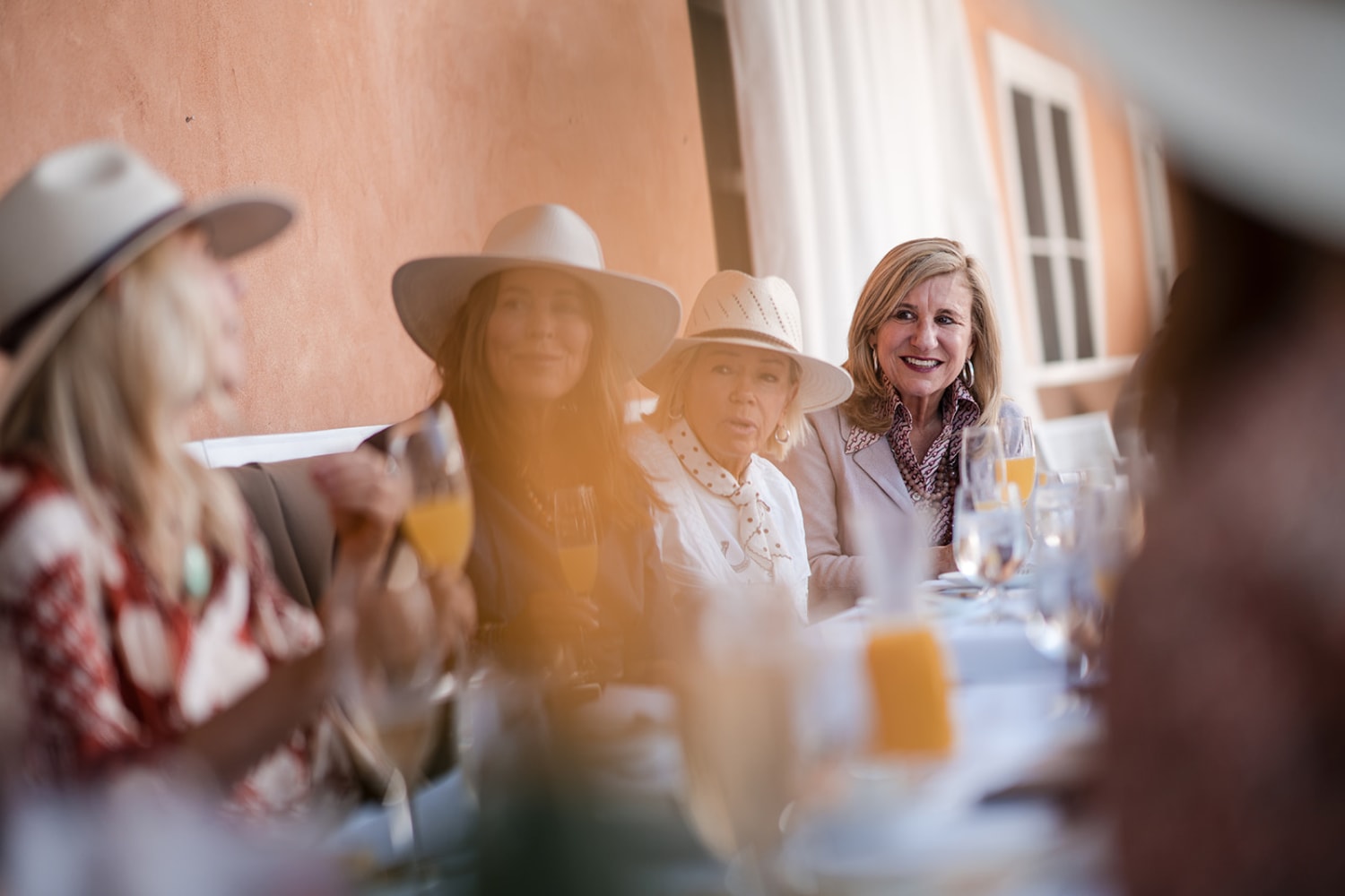 gathering captures a moment at what appears to be a Santa Fe or New Mexico-style venue, evidenced... — Casey Addason Photography