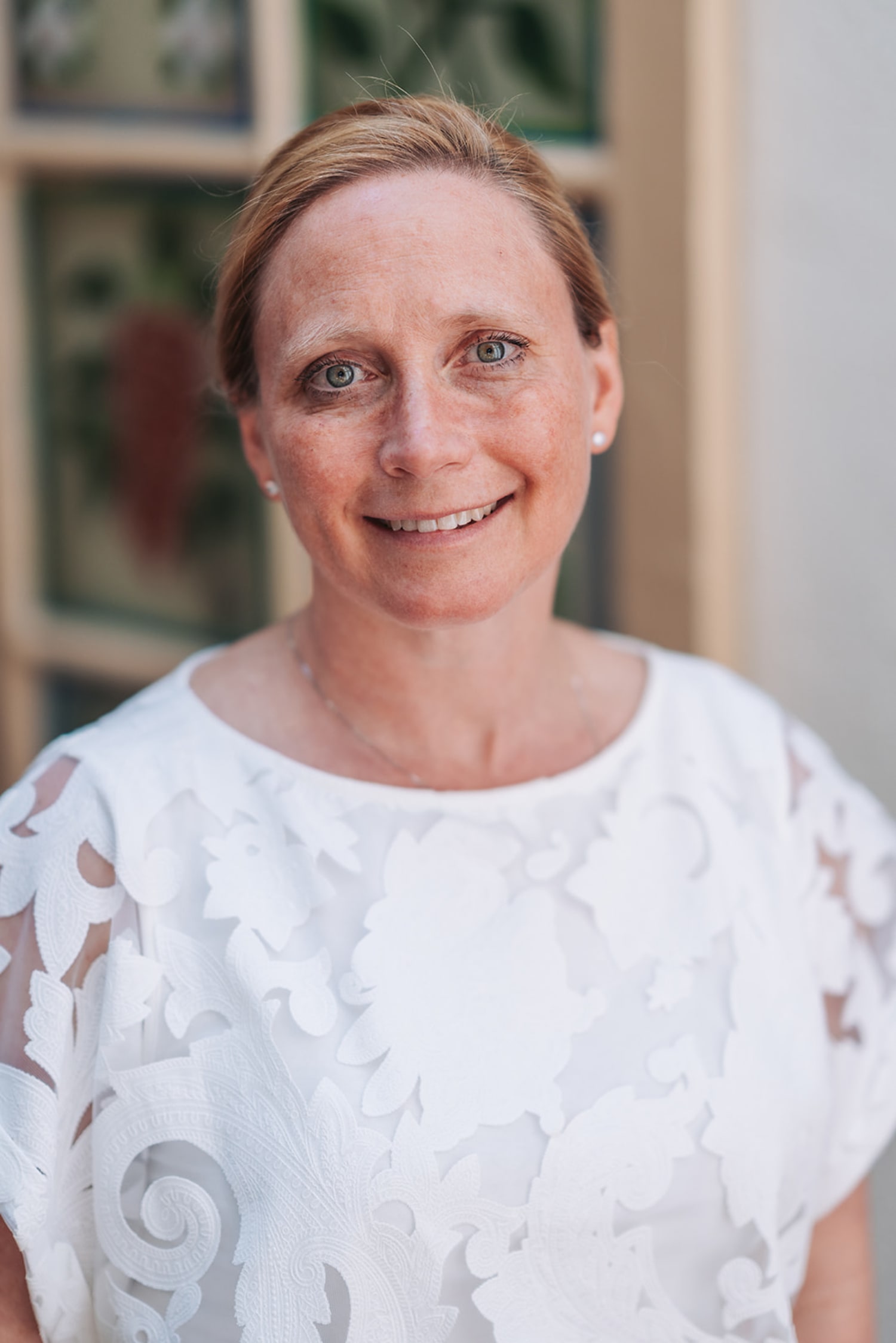 professional headshot taken indoors with natural window lighting that creates soft, even illumina... — Casey Addason Photography