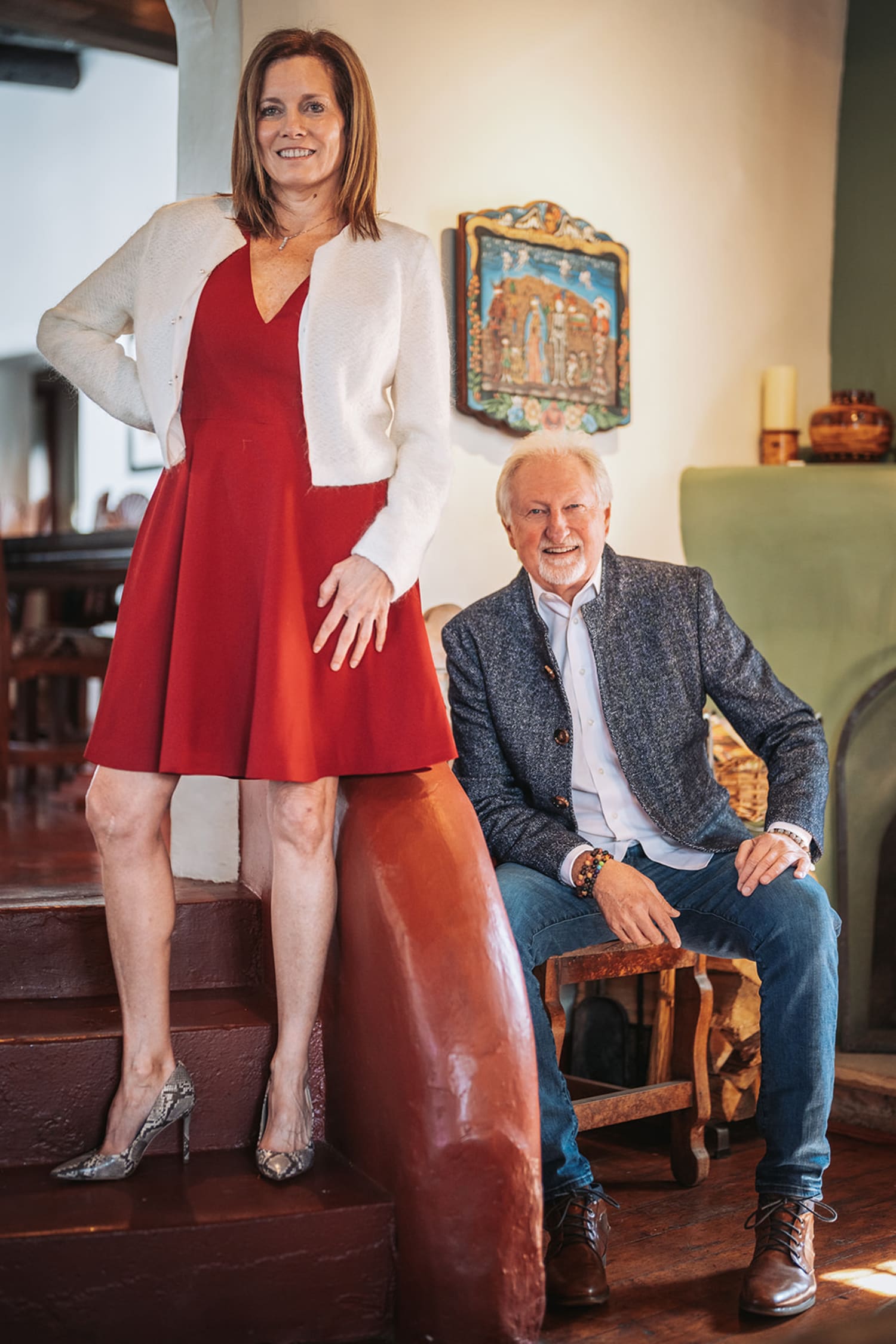 portrait captures two subjects posed in what appears to be a Santa Fe-style home, characterized b... — Casey Addason Photography