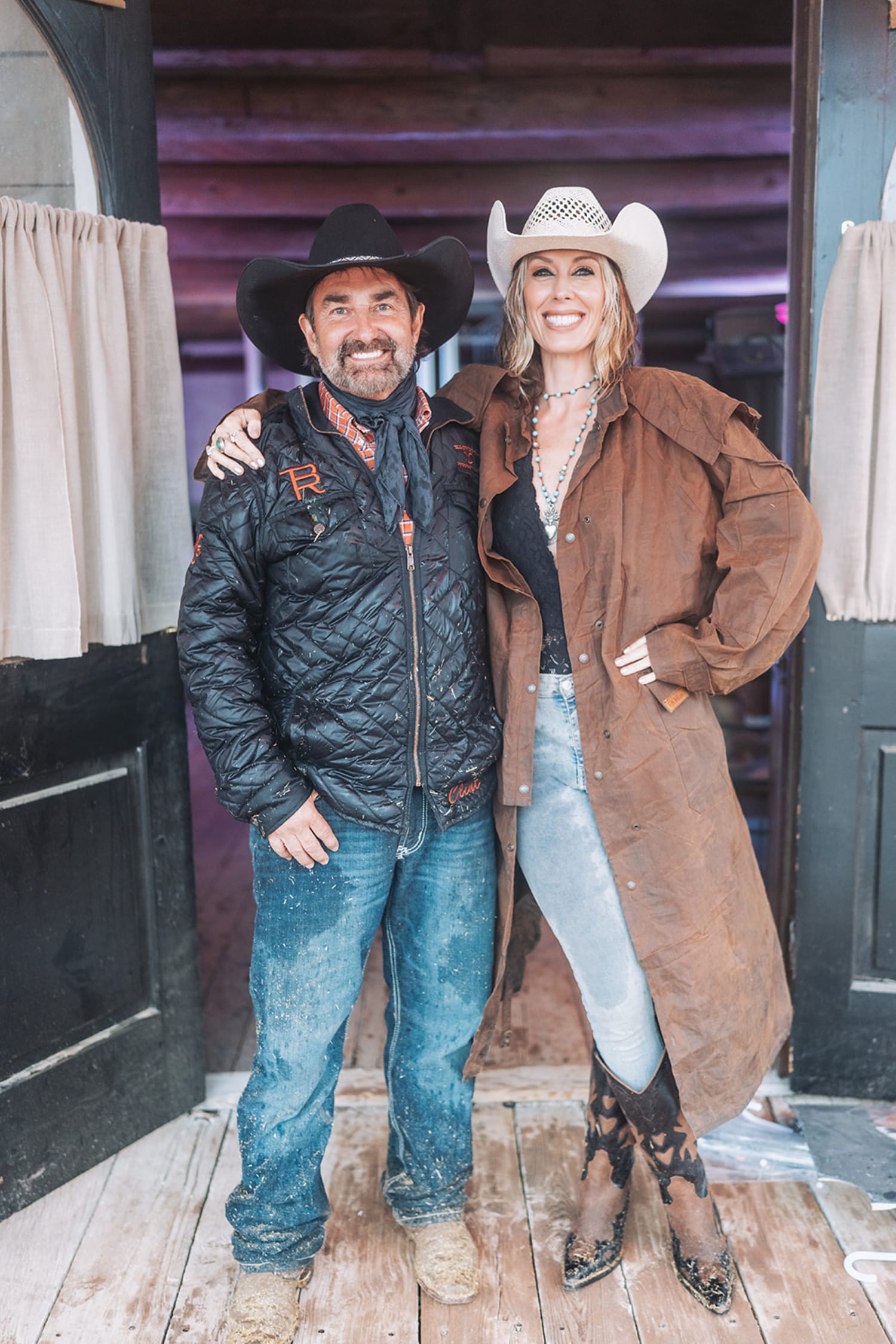portrait captures two people in coordinated Western attire at what appears to be an indoor barn o... — Casey Addason Photography