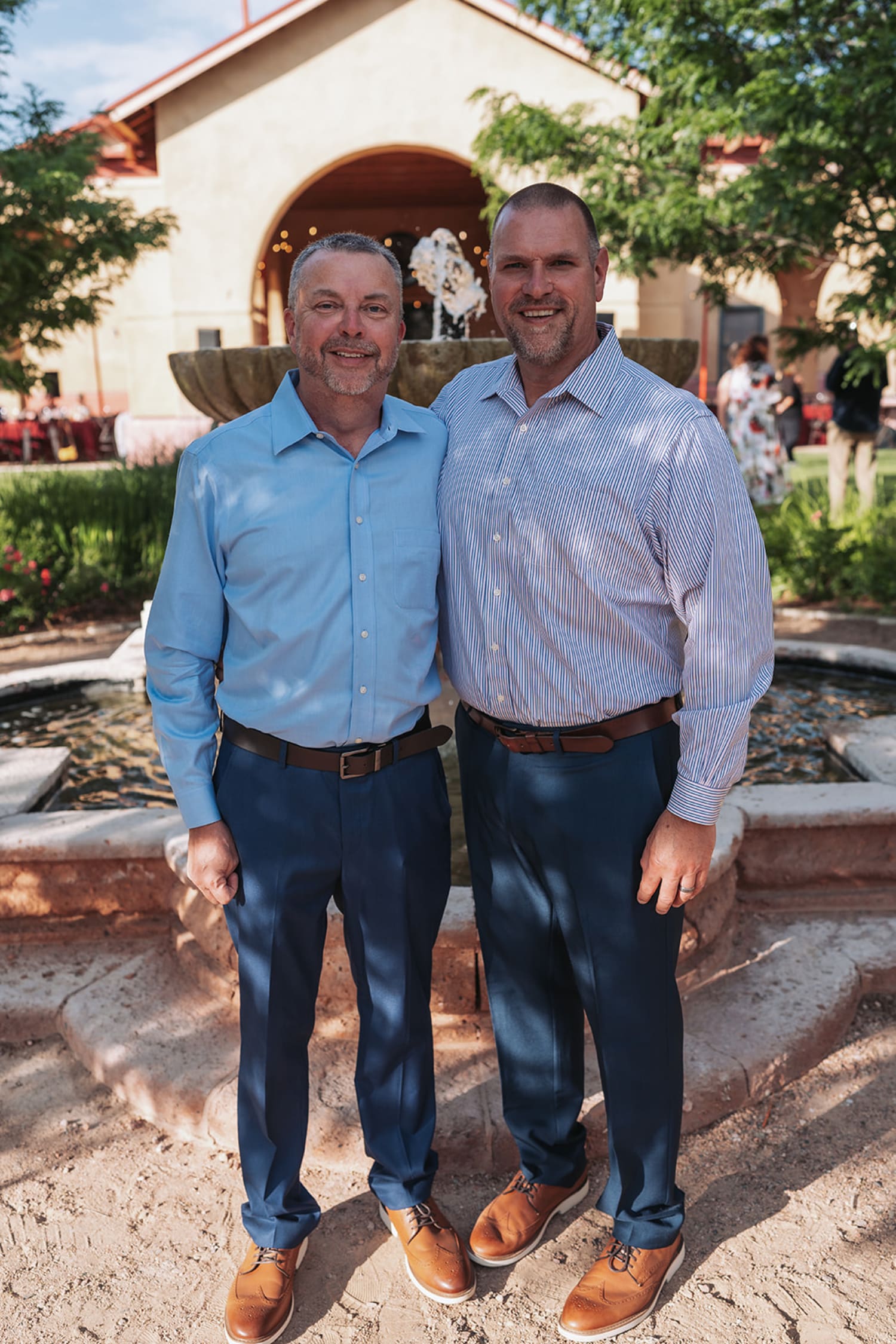 Two executives at Spanish Colonial-style venue in golden hour light for Albuquerque corporate portrait - Casey Addason Photography