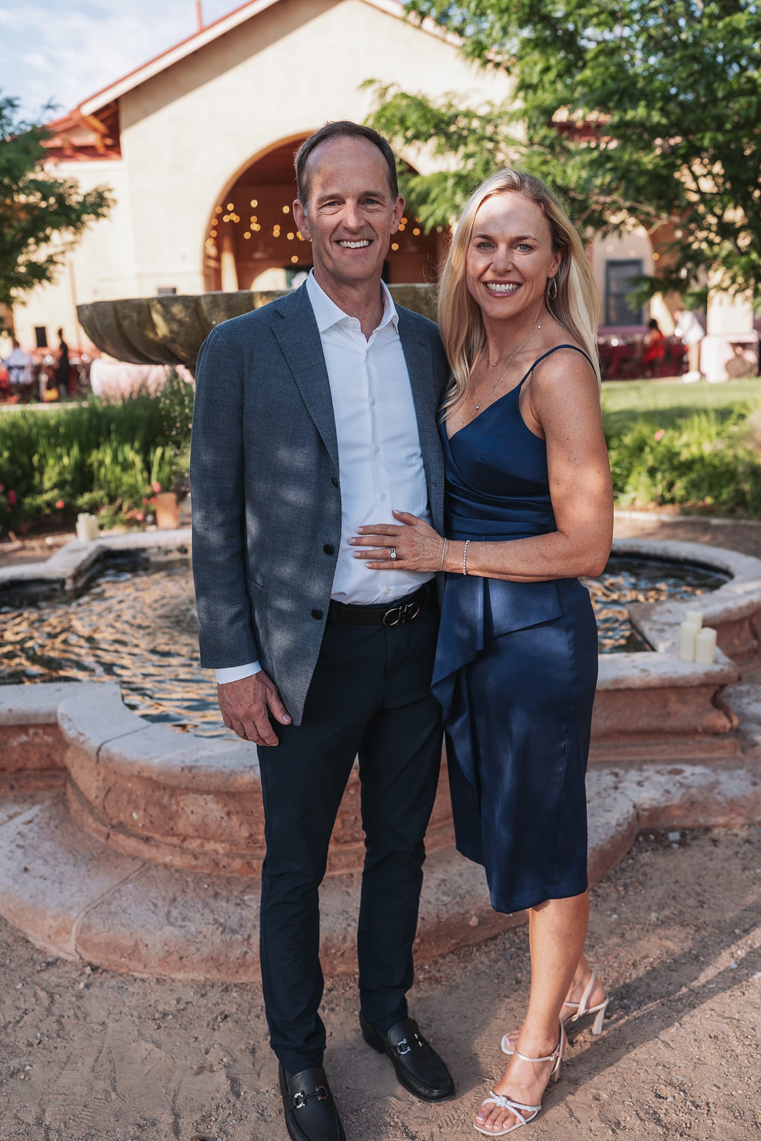 Couple portrait at Spanish Colonial courtyard venue with adobe walls and ivy for Albuquerque corporate event - Casey Addason Photography