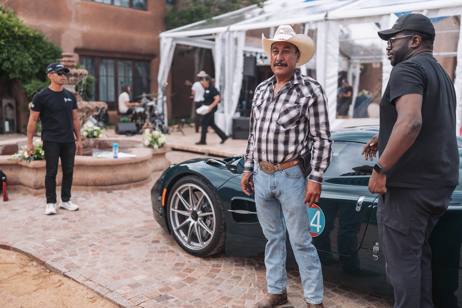 candid photograph captures a production moment at an upscale courtyard venue featuring classic So... — Casey Addason Photography