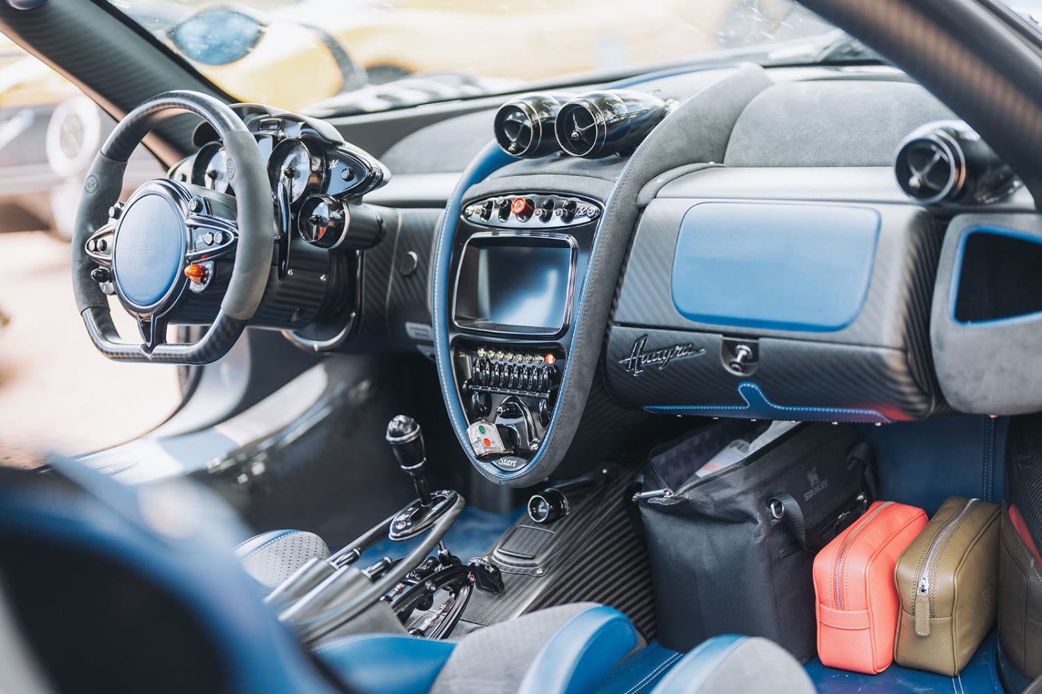photograph showcases the meticulously customized interior of a high-end sports car, captured in n... — Casey Addason Photography