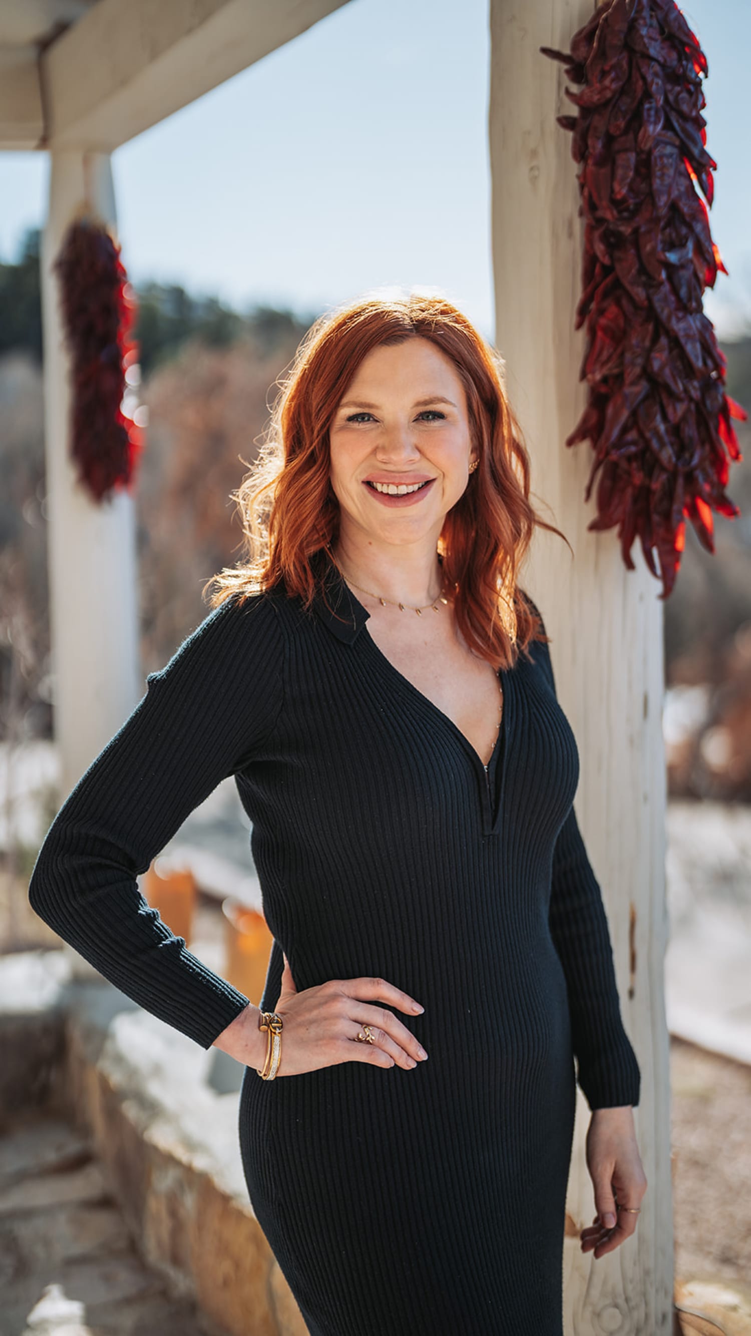 portrait session documents a woman posed against weathered beige stucco columns and walls characte... — Casey Addason Photography