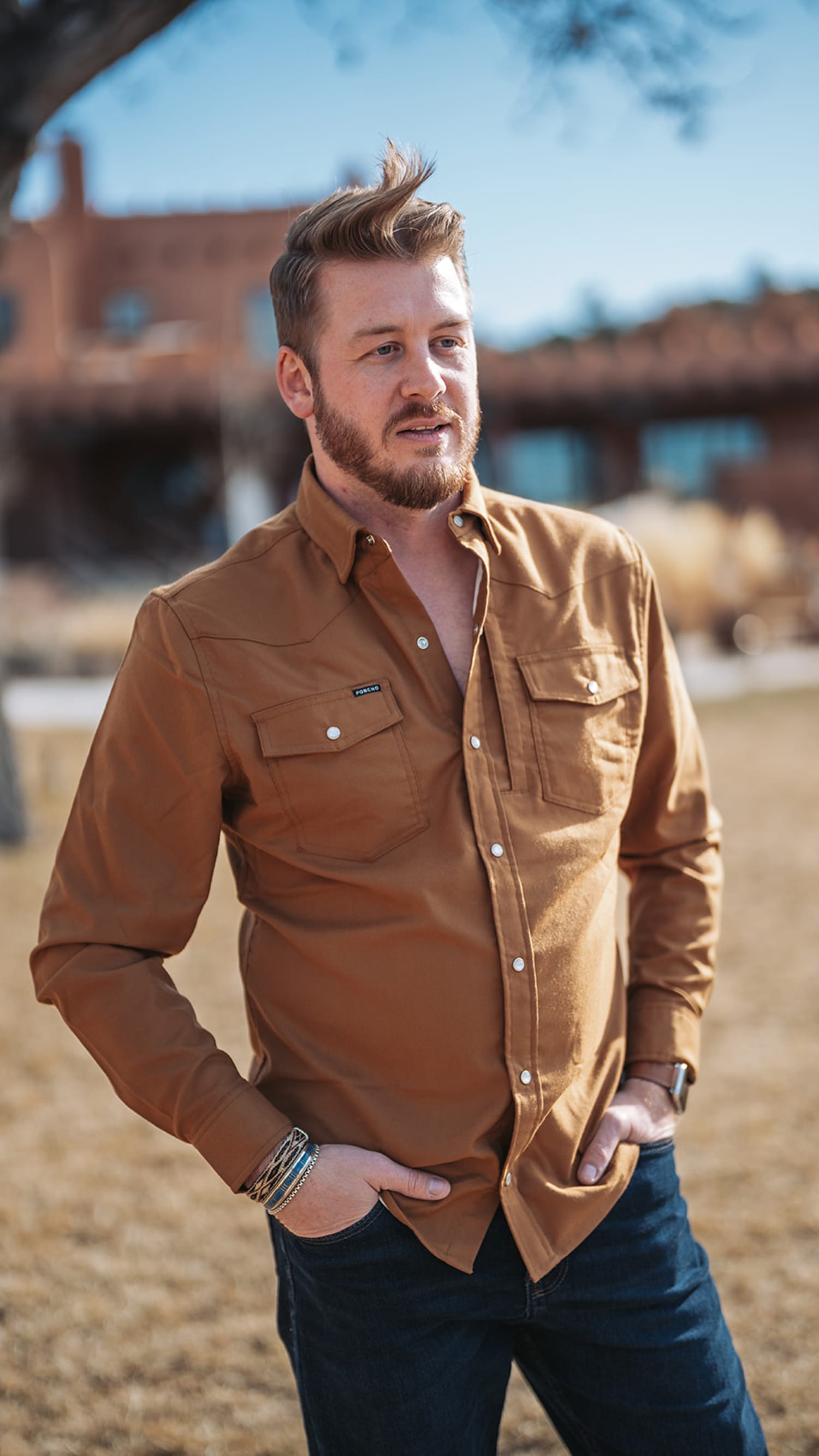 portrait photograph taken at an outdoor venue featuring rustic brick industrial architecture in t... — Casey Addason Photography