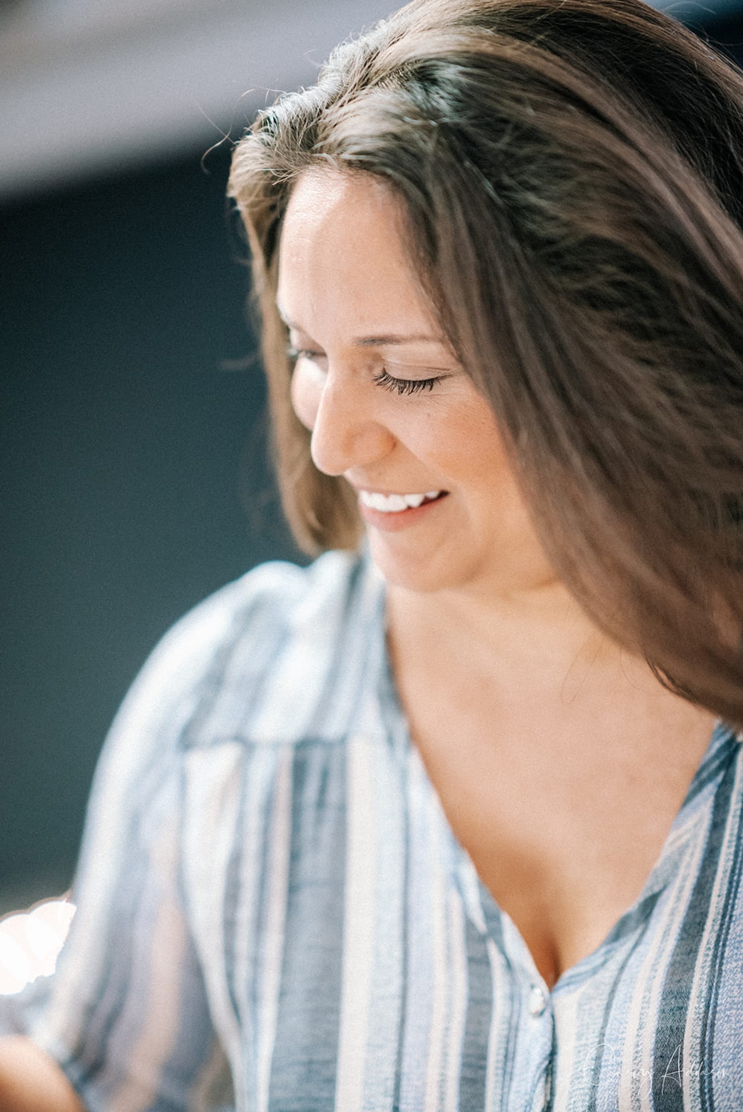 professional portrait photograph taken outdoors during golden hour, featuring a woman in profile ... — Casey Addason Photography
