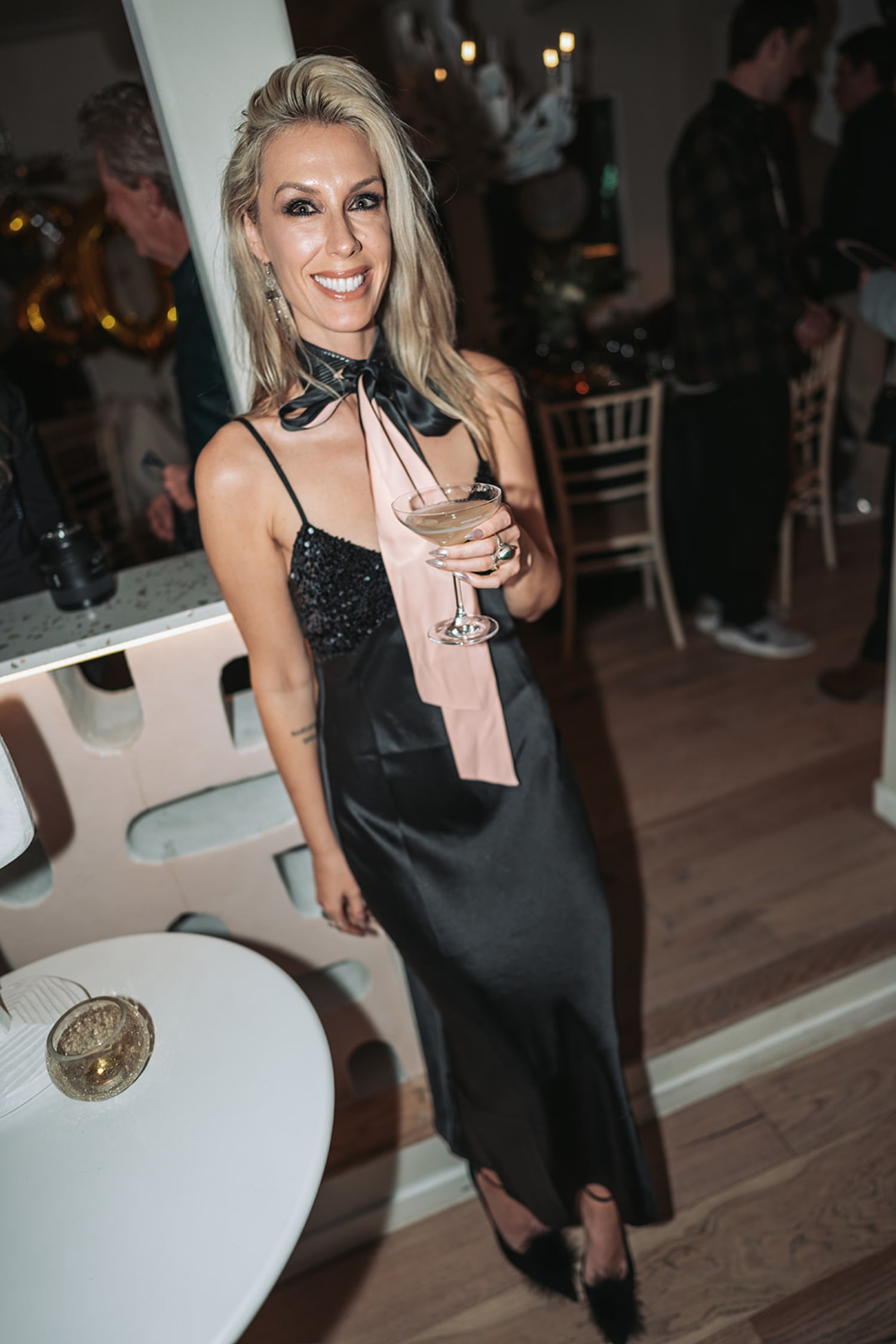 Reception guest in elegant interior at The Mystic Santa Fe, warm ambient lighting, Casey Addason Photography