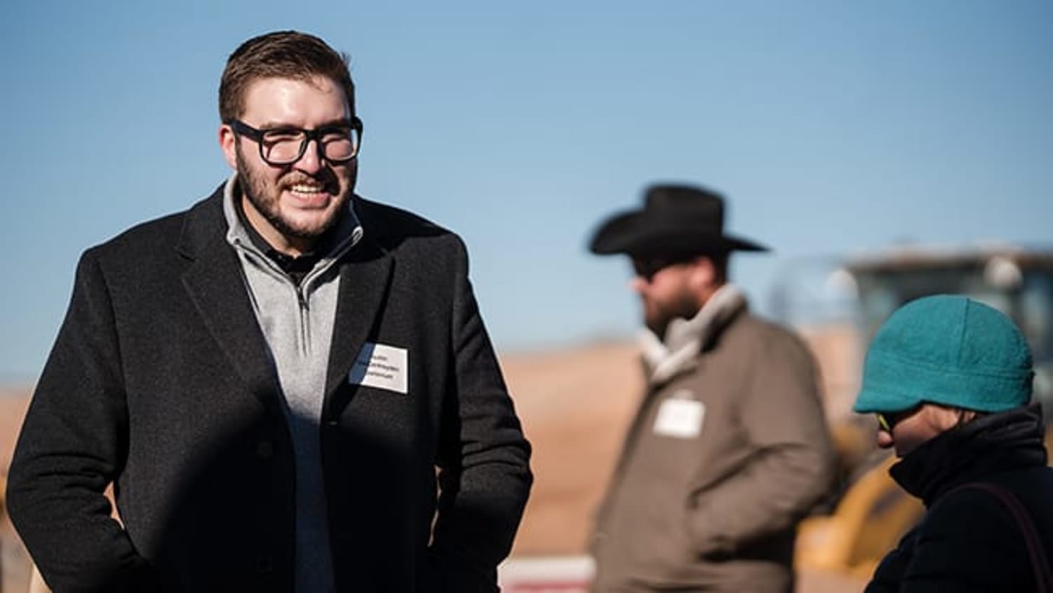 Attendee at the Dominium groundbreaking, Santa Fe — editorial corporate photography by Casey Addason