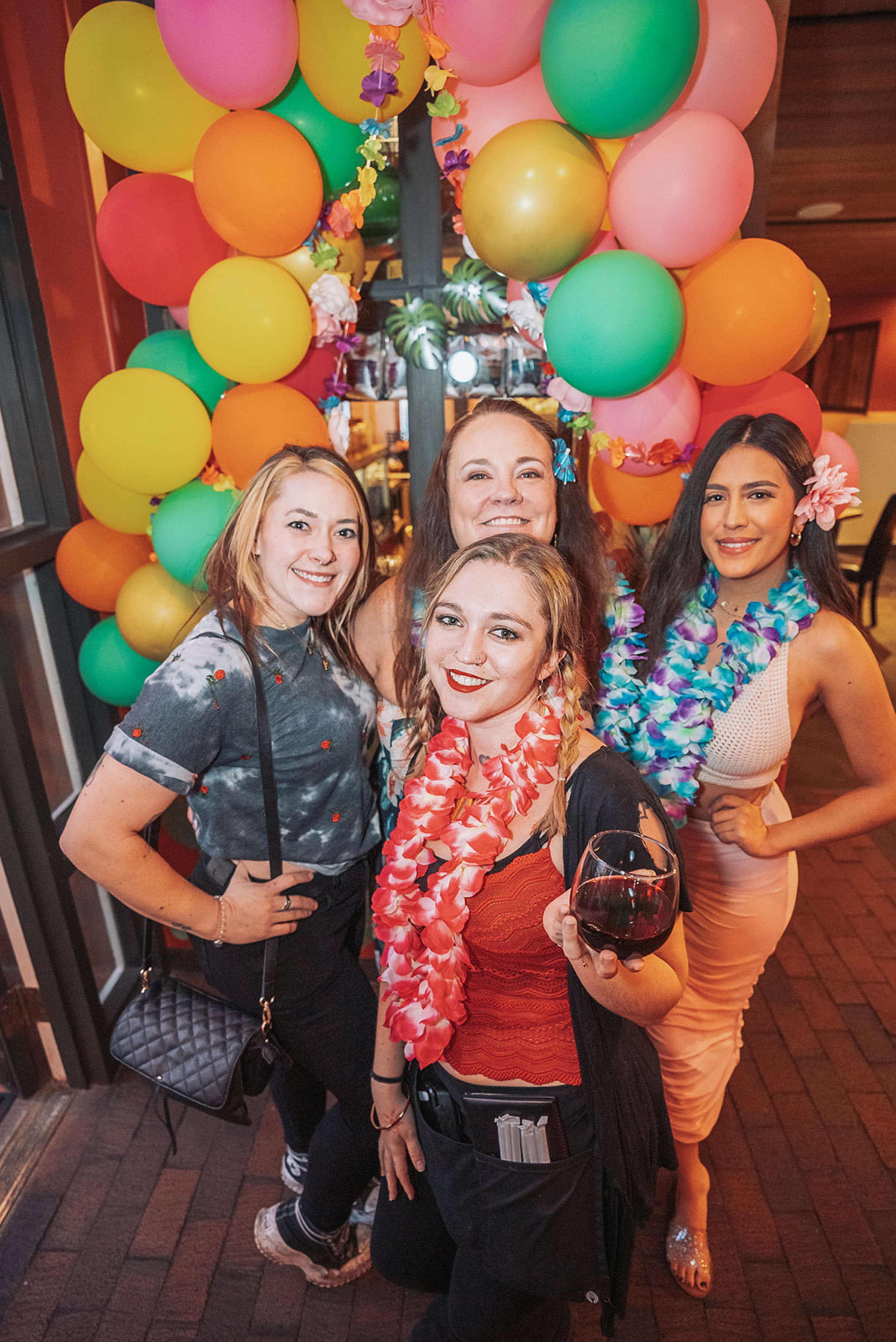 Candid moment — genuine connection between guests, unposed and unaware