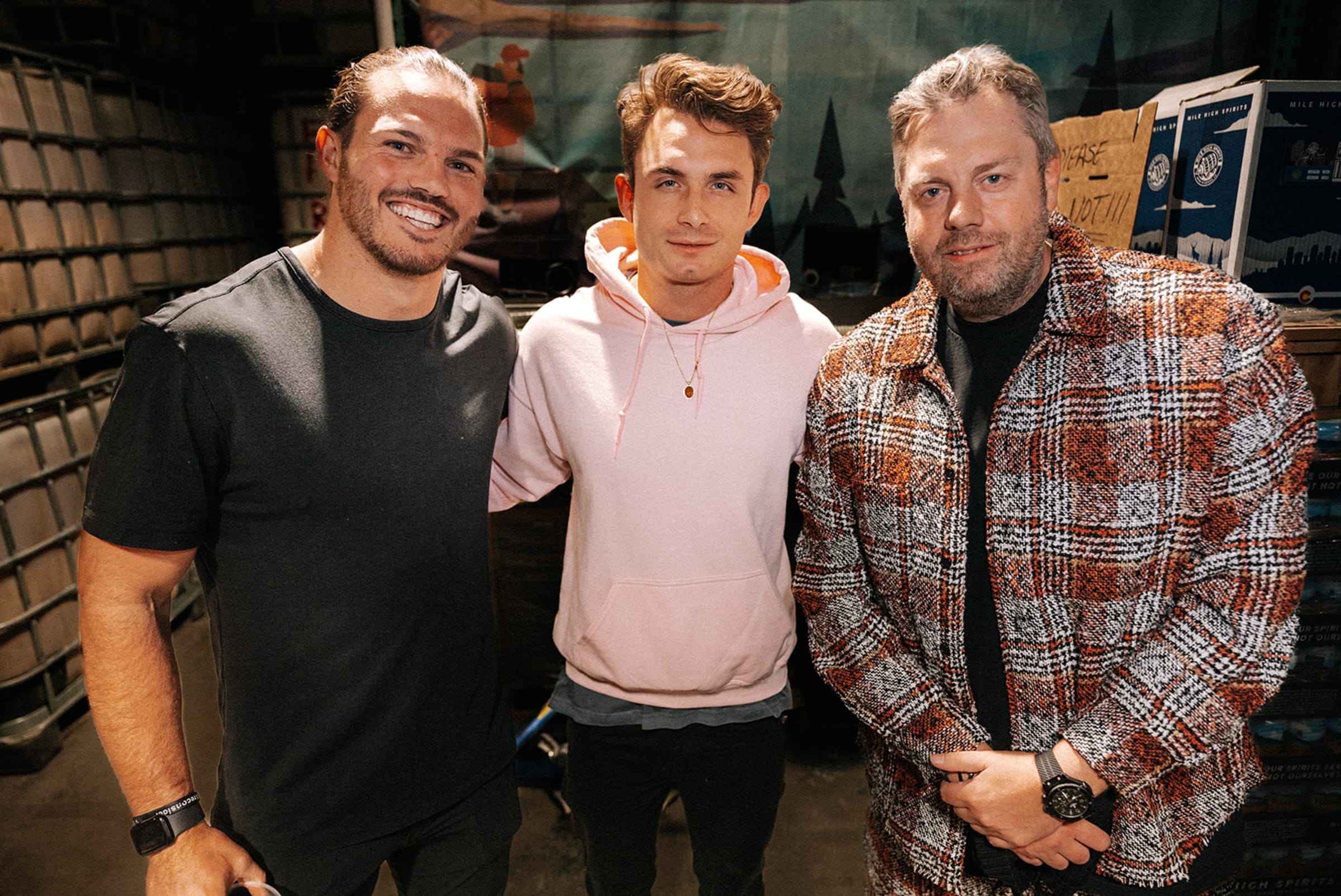 Wide shot of a live event crowd in Santa Fe, capturing the collective energy of the room