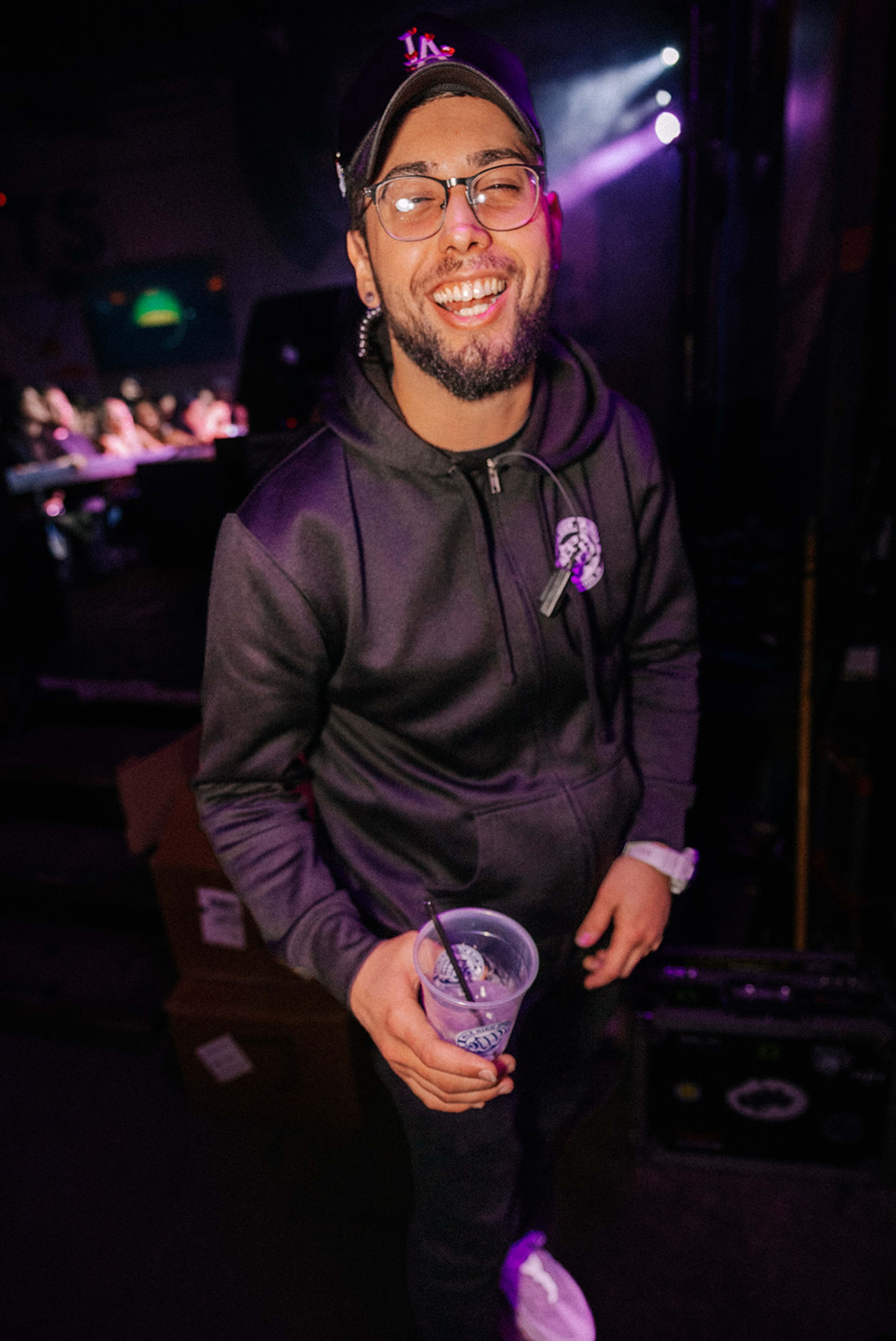 Dynamic performance shot from stage-level angle showing the energy of a live event in Santa Fe, New Mexico