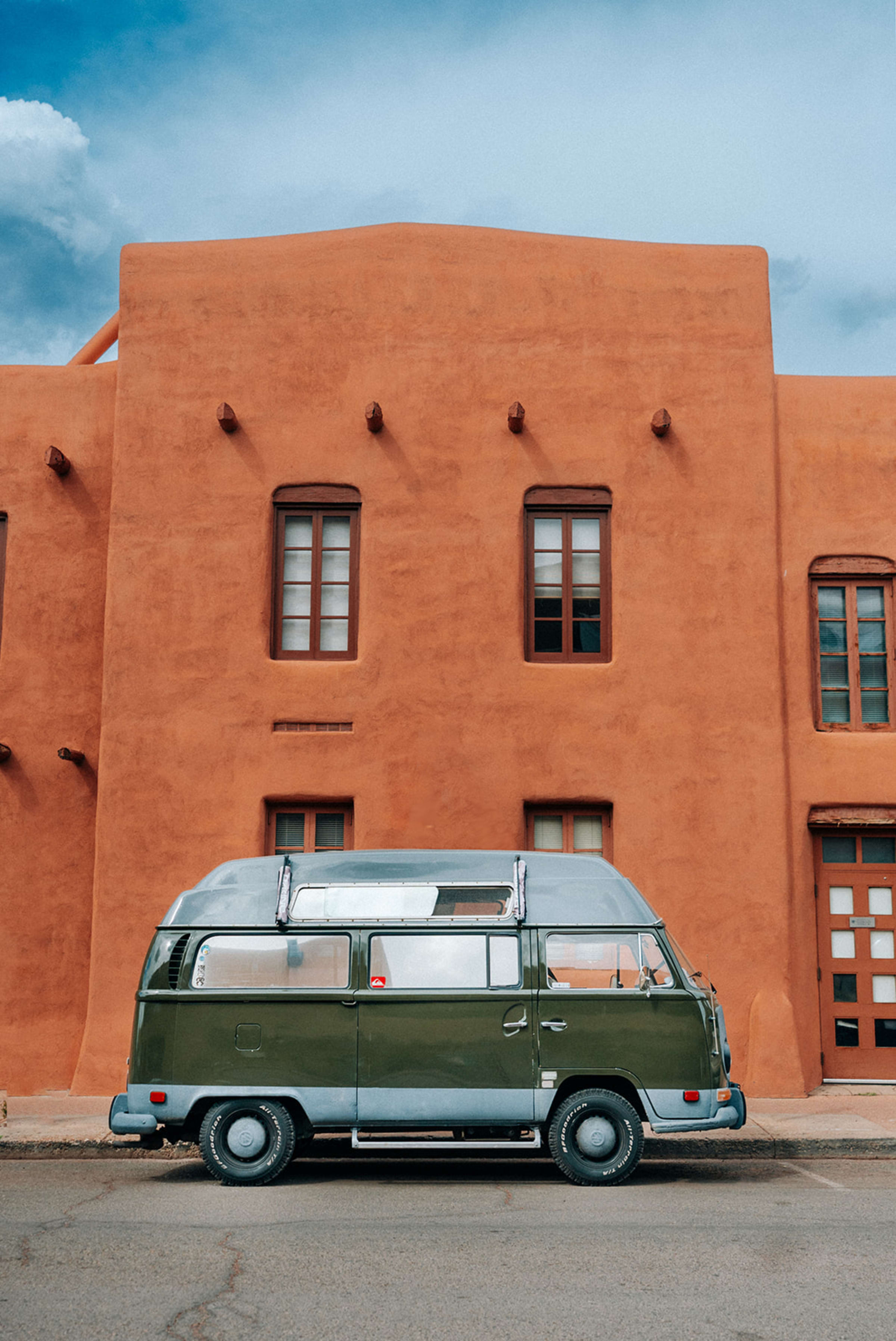 Portrait session Santa Fe — natural movement in adobe doorway