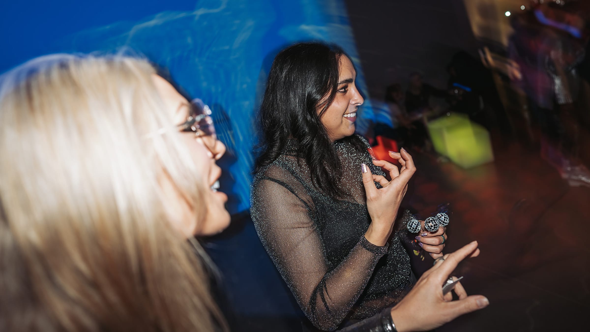 Guests in conversation at the holiday gathering